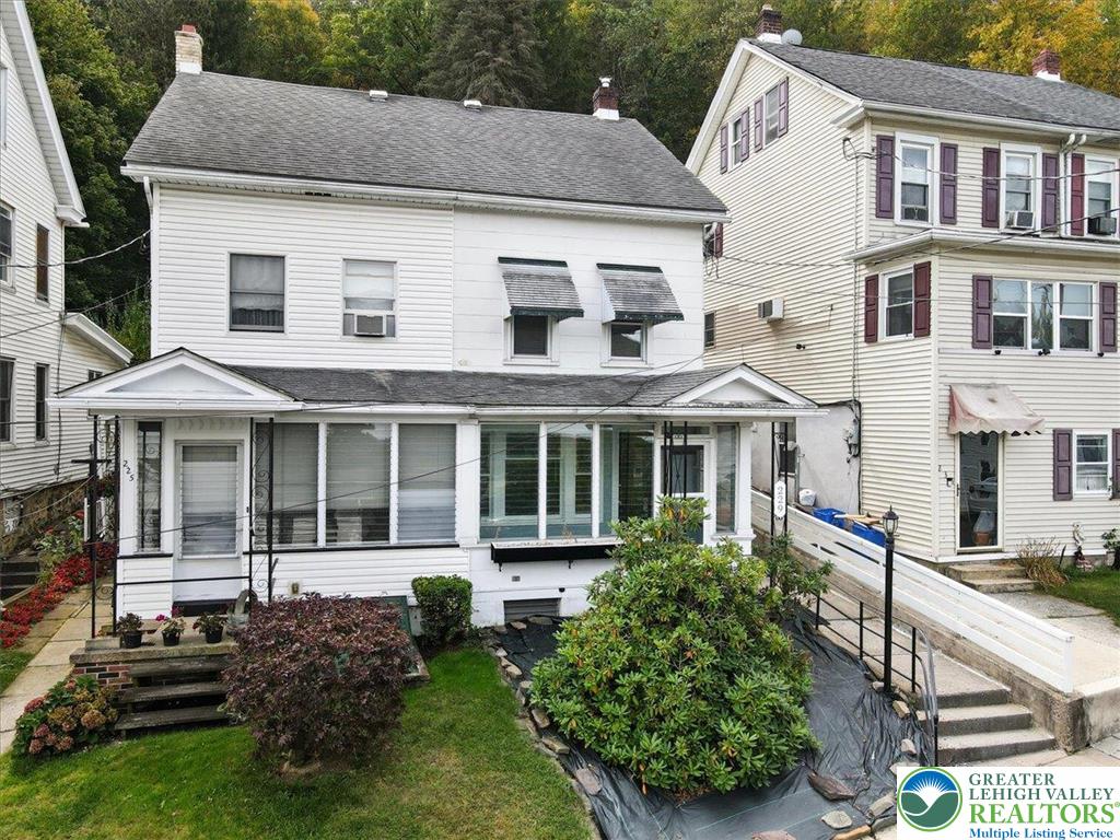 229 West High Street Nesquehoning, PA 18240 - Photo 1 of 38 a front view of a house with a yard