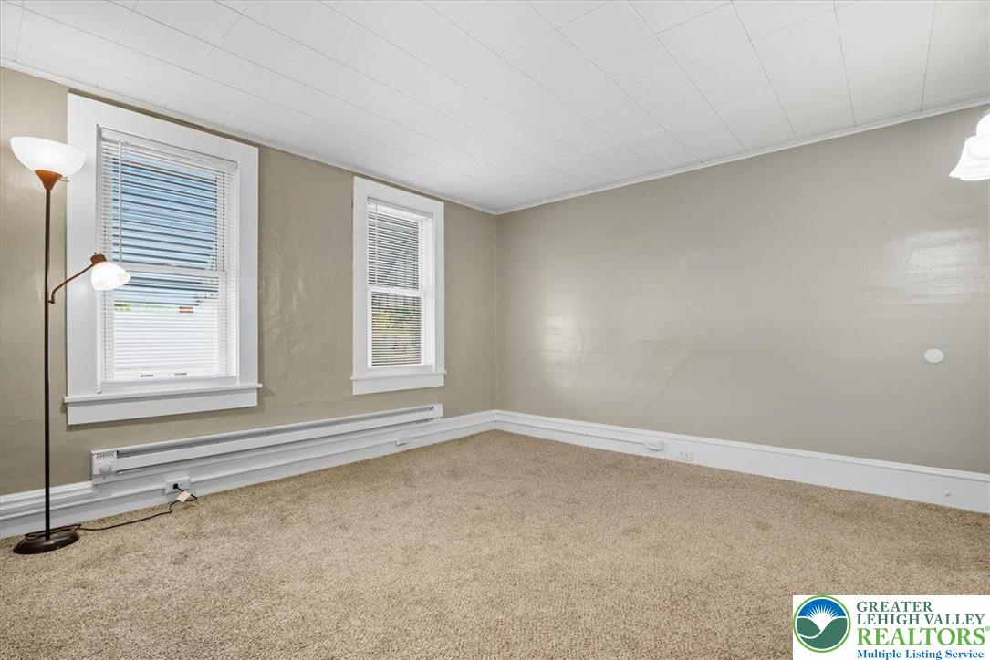 229 West High Street Nesquehoning, PA 18240 - Photo 17 of 38 a view of an empty room with a window