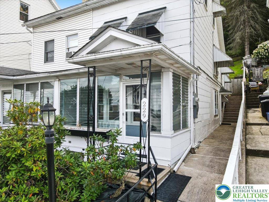229 West High Street Nesquehoning, PA 18240 - Photo 2 of 38 a front view of a house with garden