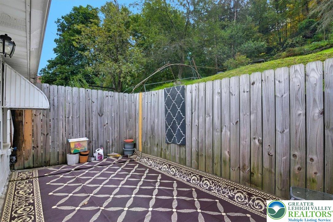 229 West High Street Nesquehoning, PA 18240 - Photo 31 of 38 a view of a backyard with wooden fence
