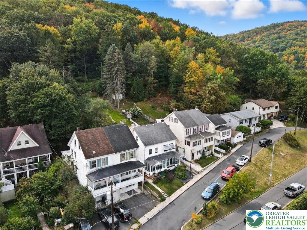 229 West High Street Nesquehoning, PA 18240 - Photo 37 of 38 an aerial view of a house with swimming pool and mountain view