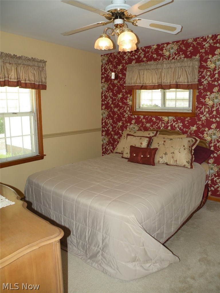 403 Rutland Street Akron, OH 44305 - Photo 12 of 26 Bedroom on first floor. Notice the detail in the coordination of the wallpaper, valences, pillows and chair rails.