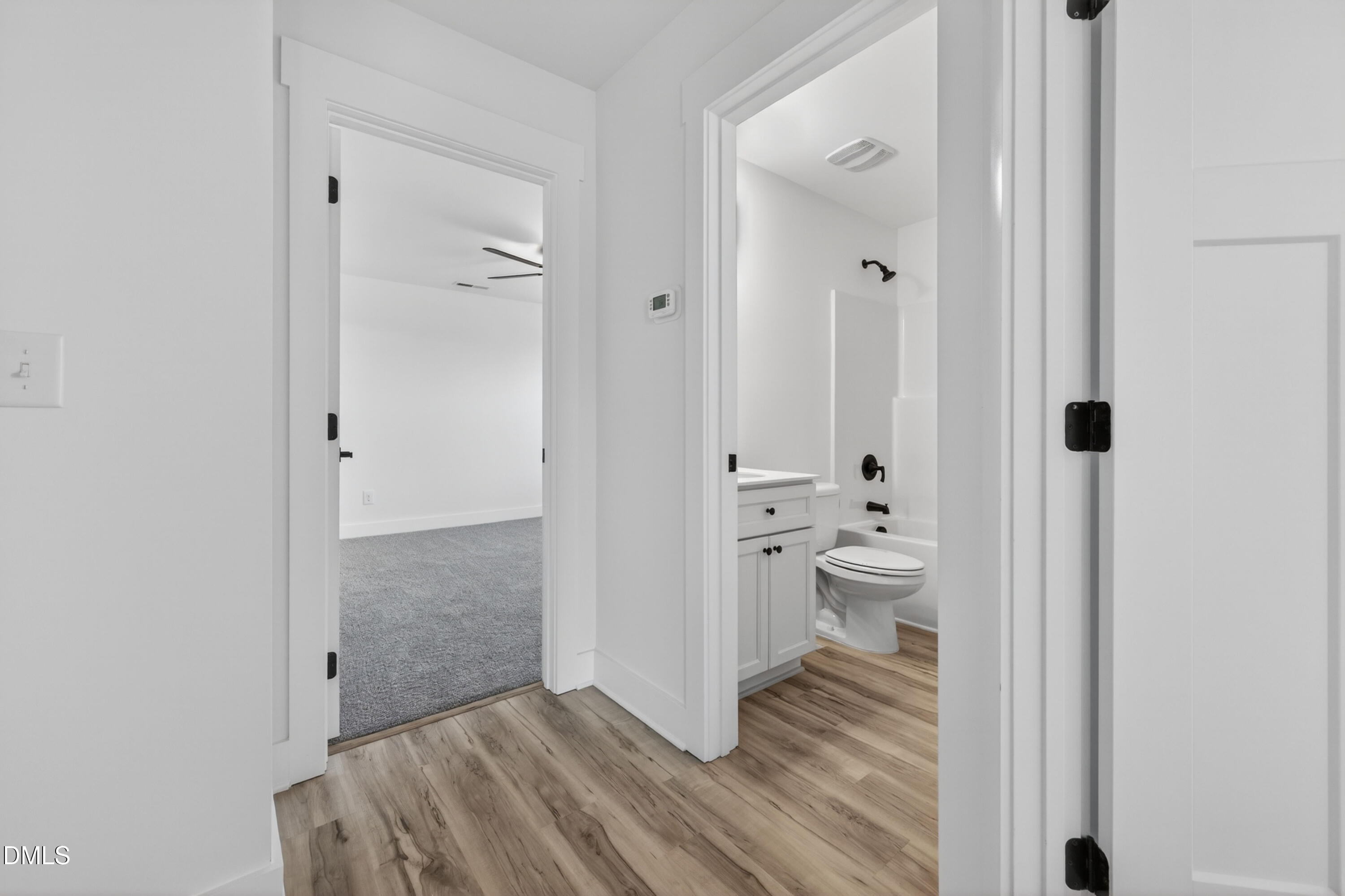 1182 Hurdle Mills Road Roxboro, NC 27573 - Photo 23 of 45 a view of bathroom with toilet shower and wooden floor