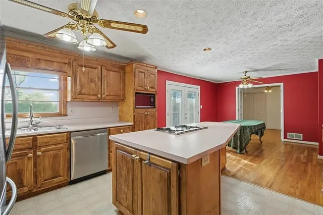 a bedroom with a bed and ceiling fan