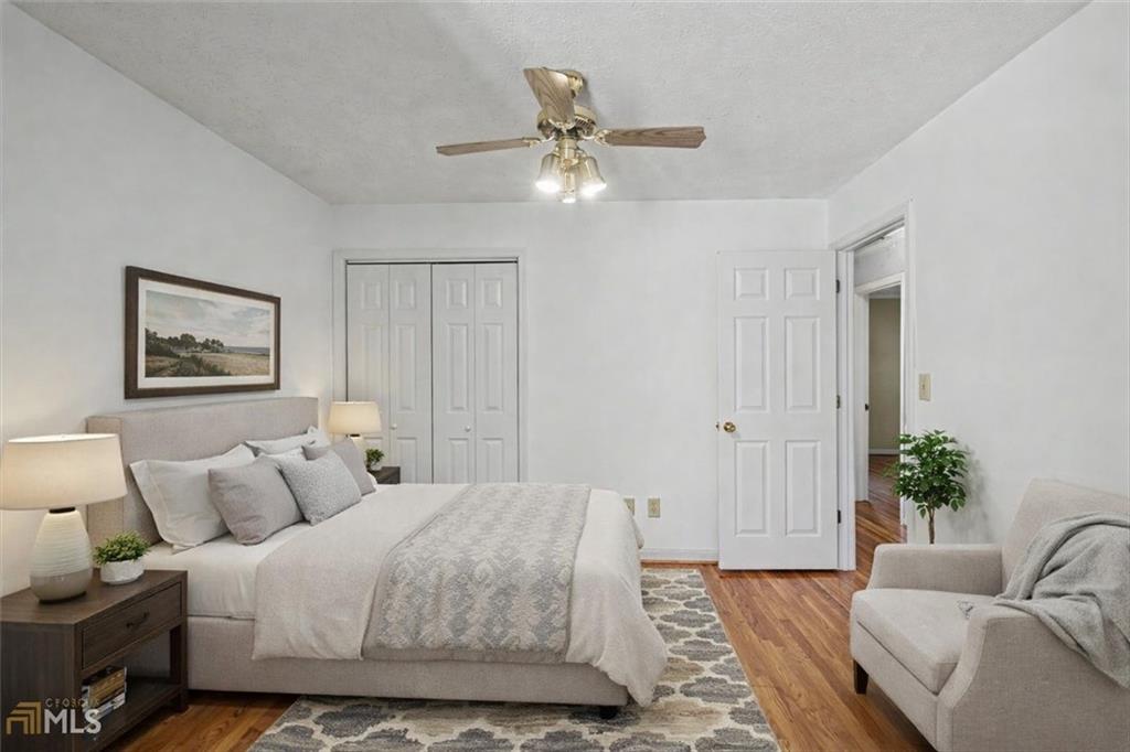 5 Ridgewood Drive Cartersville, GA 30120 - Photo 15 of 46 a bedroom with a bed and ceiling fan