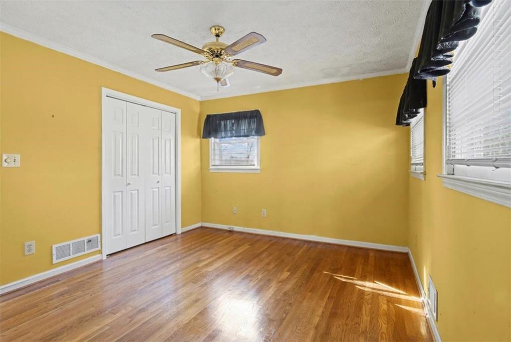5 Ridgewood Drive Cartersville, GA 30120 - Photo 19 of 46 a view of room with wooden floor and ceiling fan