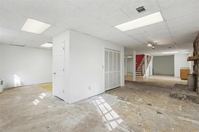 a view of a livingroom with wooden floor and a window