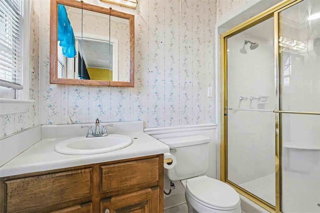 5 Ridgewood Drive Cartersville, GA 30120 - Photo 23 of 46 a bathroom with a sink toilet and shower