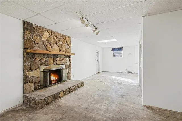 a balcony with wooden floor and outdoor space