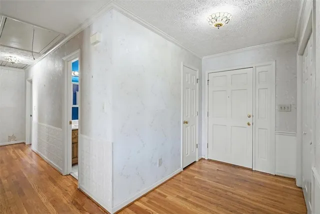 a kitchen with stainless steel appliances granite countertop a stove and a refrigerator