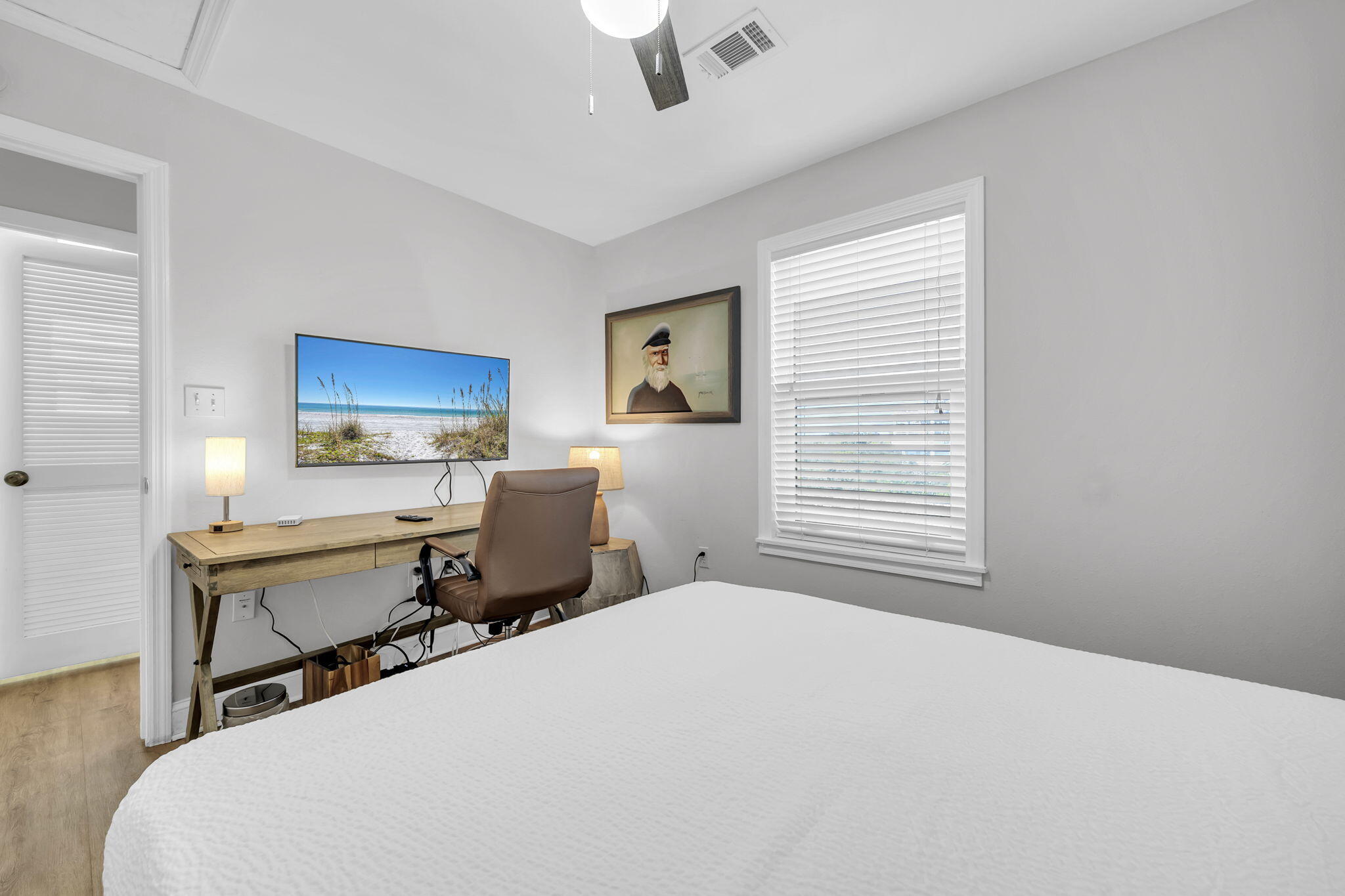 11 Beachside Drive, Unit 131 Santa Rosa Beach, FL 32459 - Photo 13 of 25 a bedroom with a bed and wooden floor