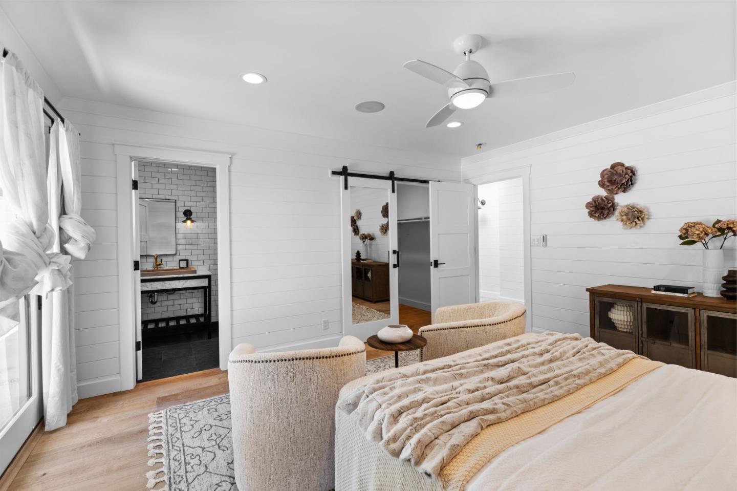 595 Summit Spring Road Woodside, CA 94062 - Photo 36 of 56 a bedroom with a bed and a chandelier