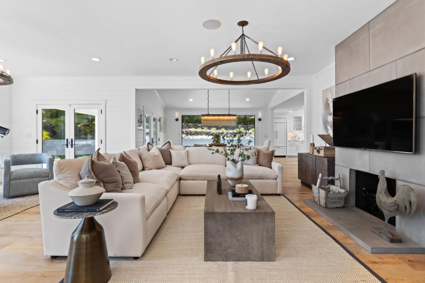 595 Summit Spring Road Woodside, CA 94062 - Photo 6 of 56 a living room with furniture a flat screen tv and a fireplace