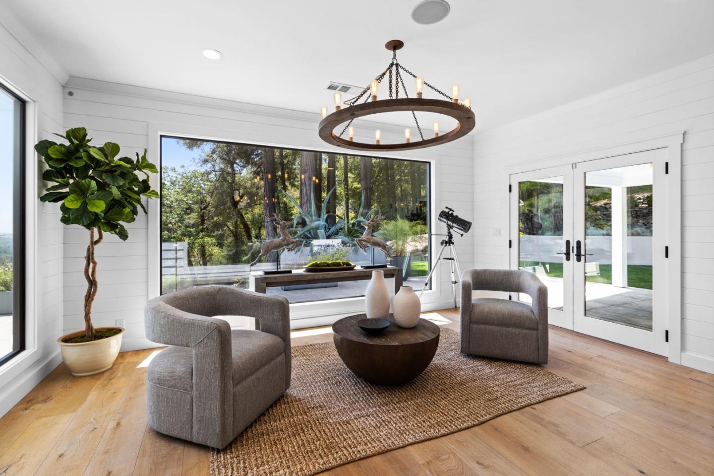 595 Summit Spring Road Woodside, CA 94062 - Photo 9 of 56 a living room with furniture and a large window