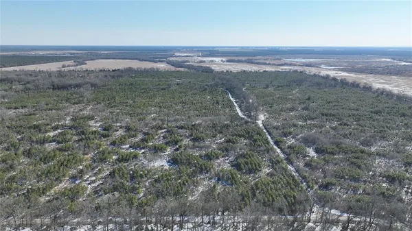 a view of an outdoor space with wooden floor