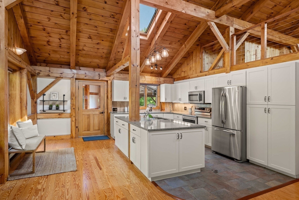 3 Whitman Place Beverly, MA 01915 - Photo 6 of 34 a kitchen with stainless steel appliances granite countertop a refrigerator and a stove
