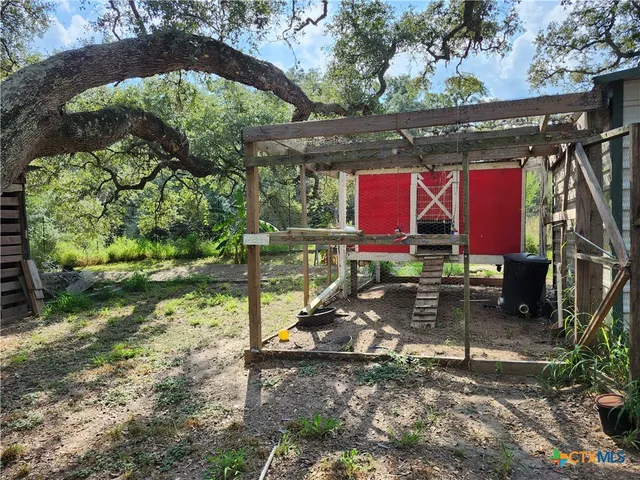 a view of a yard with an trees