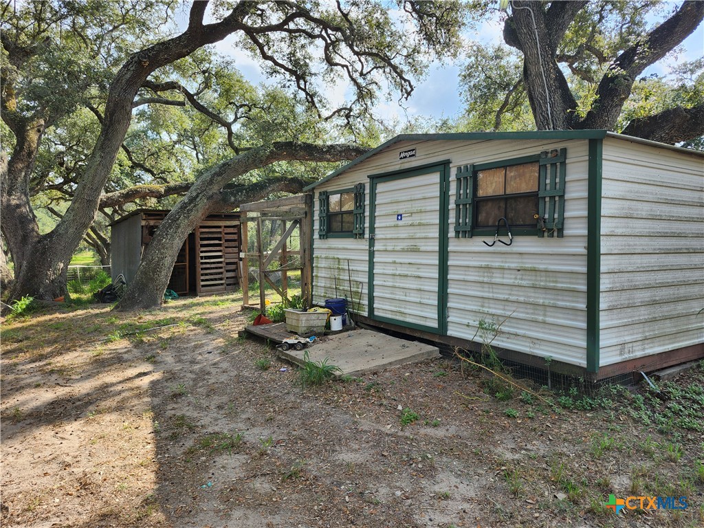 96 Reeves Ranch Road Victoria, TX 77905 - Photo 13 of 16 a view of a small house with a tree in the yard