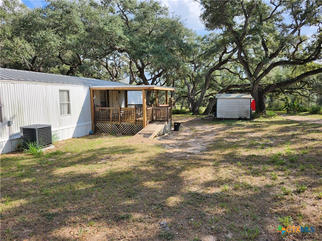 96 Reeves Ranch Road Victoria, TX 77905 - Photo 16 of 16 a view of a house with a yard