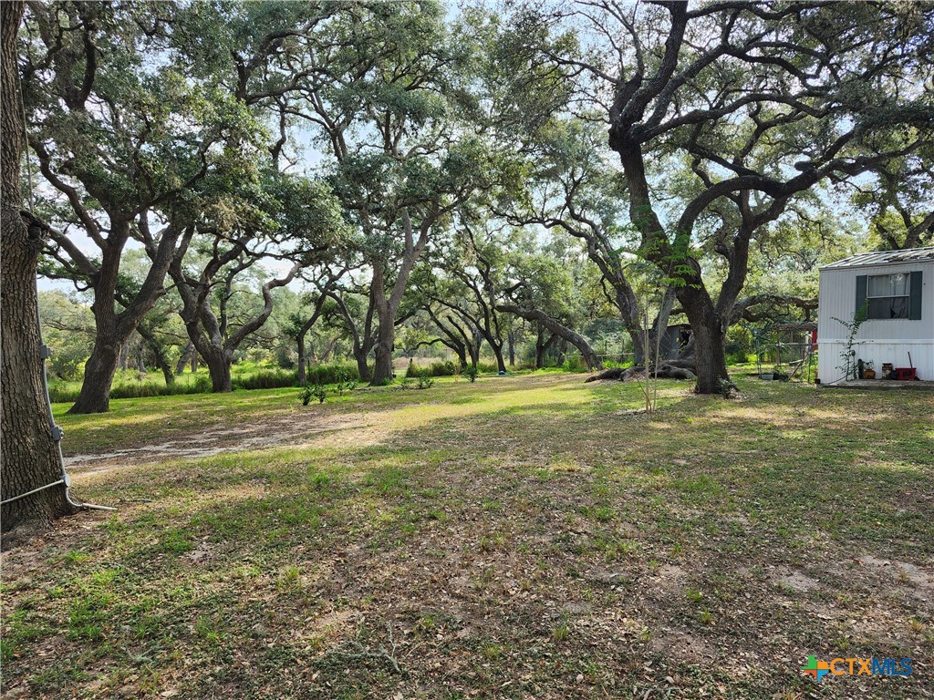96 Reeves Ranch Road Victoria, TX 77905 - Photo 3 of 16 a view of outdoor space with deck and yard