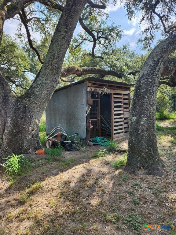 96 Reeves Ranch Road Victoria, TX 77905 - Photo 10 of 16 a backyard of a house with lots of green space