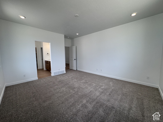 2613 Scarlet Road, Unit 258 Eagle Mountain, UT 84005 - Photo 13 of 30 Recessed lighting, plush carpeting, white walls, wood-finish flooring, and a dark wood-finish vanity