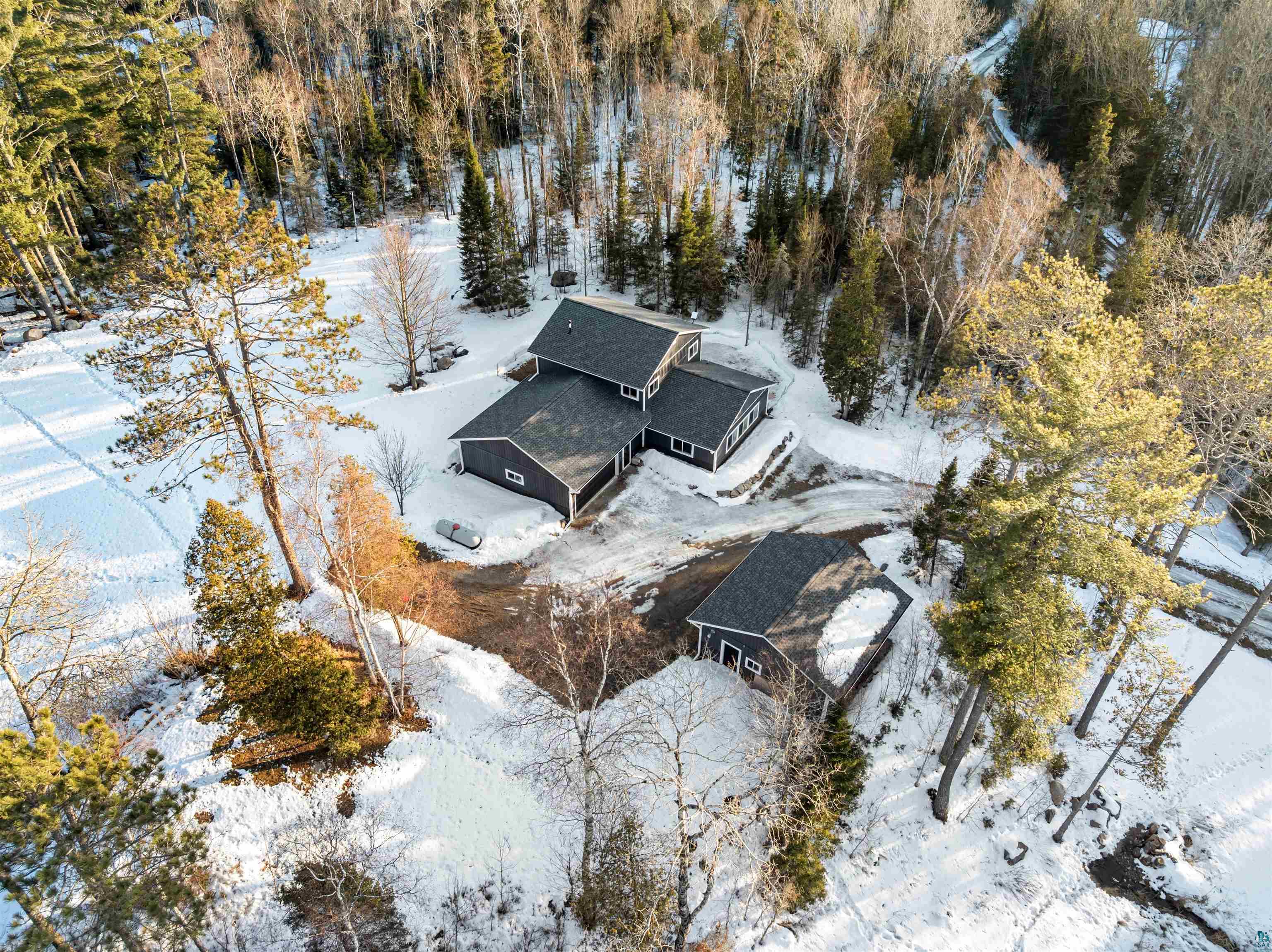 13462 Villa Road Ely, MN 55731 - Photo 39 of 68 Snowy aerial view with view of scattered trees