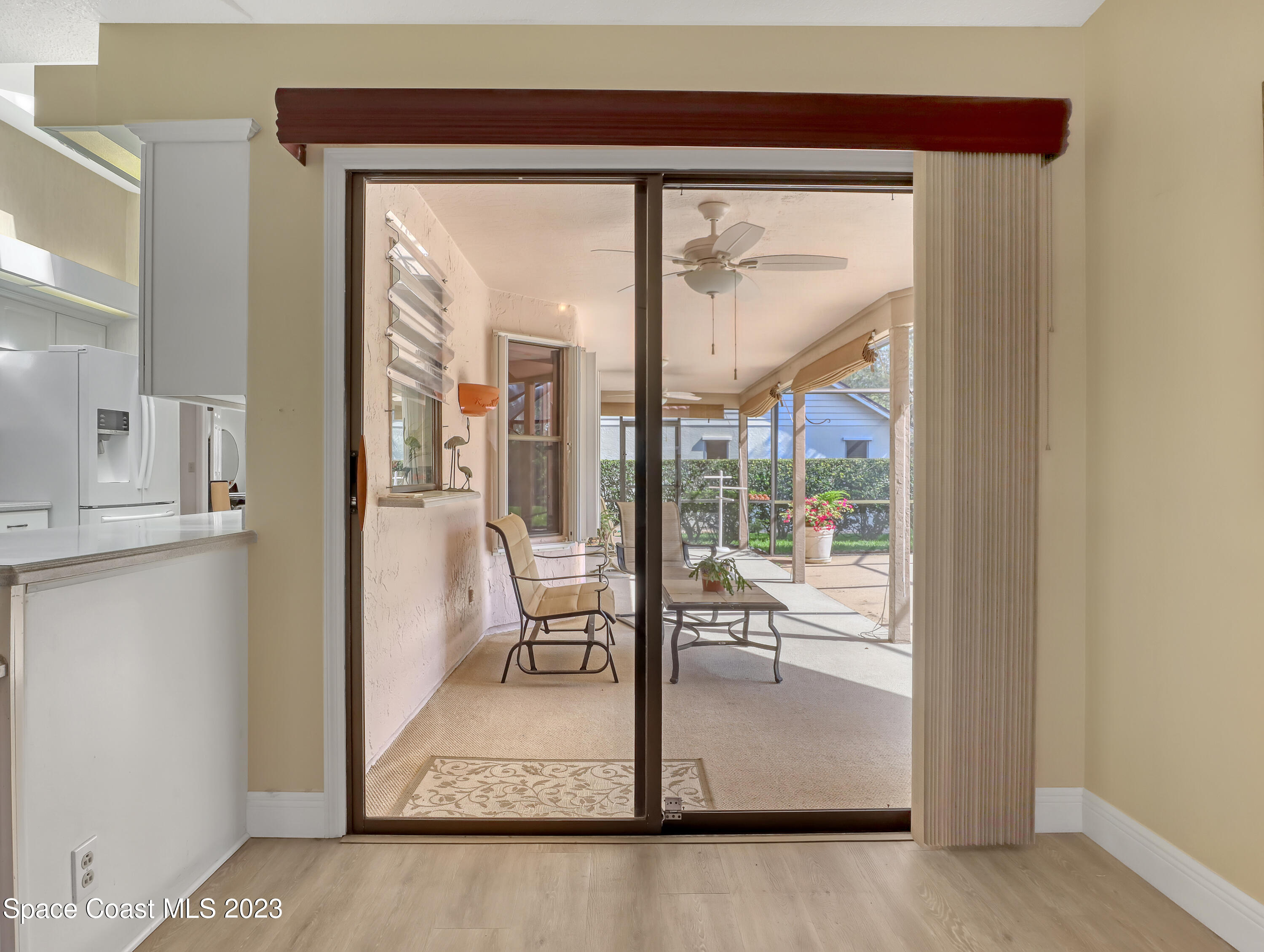 705 Casa Grande Drive Melbourne, FL 32940 - Photo 15 of 32 a view of a living room and a glass door