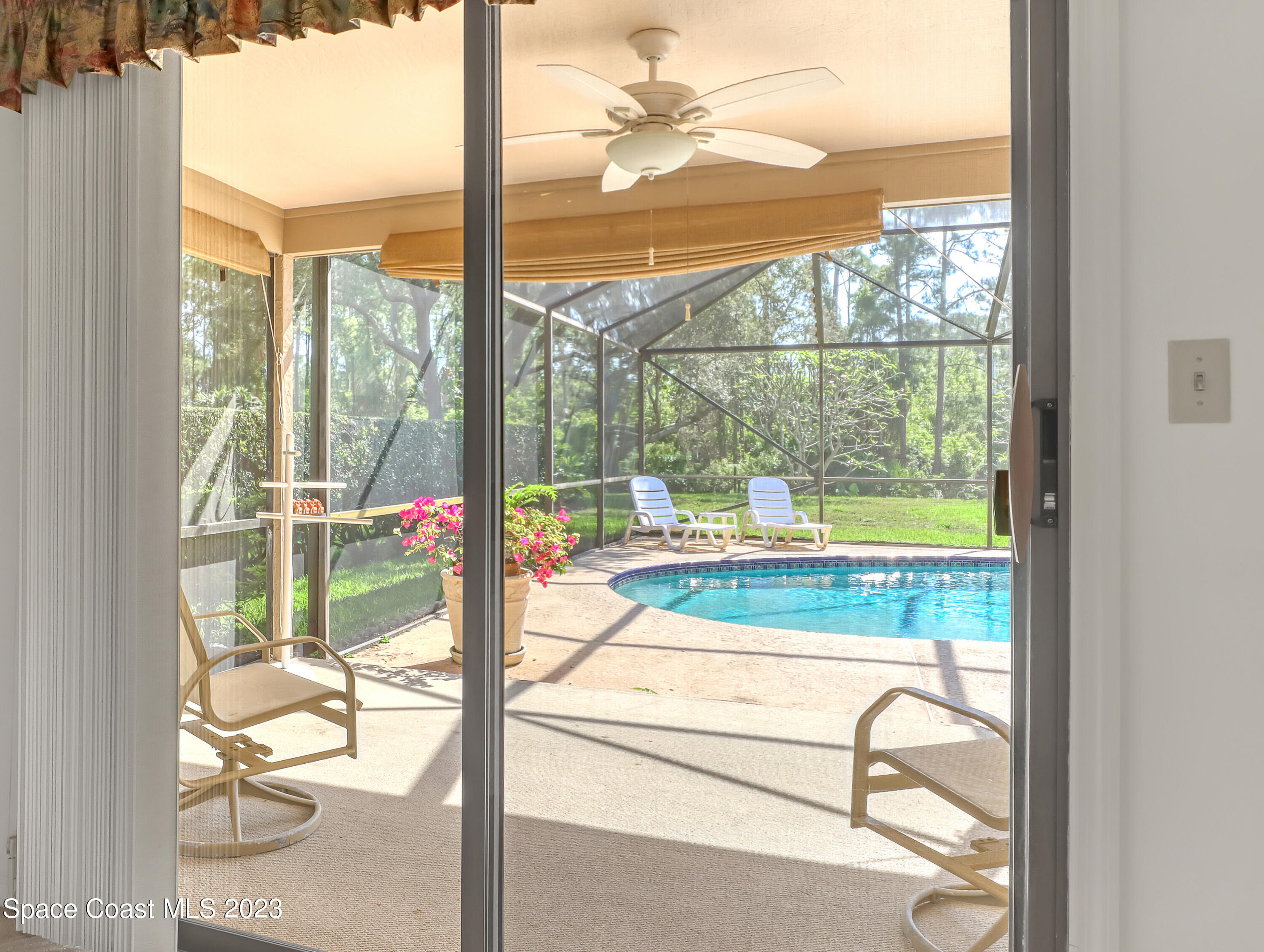705 Casa Grande Drive Melbourne, FL 32940 - Photo 18 of 32 a view of a living room and floor to ceiling window