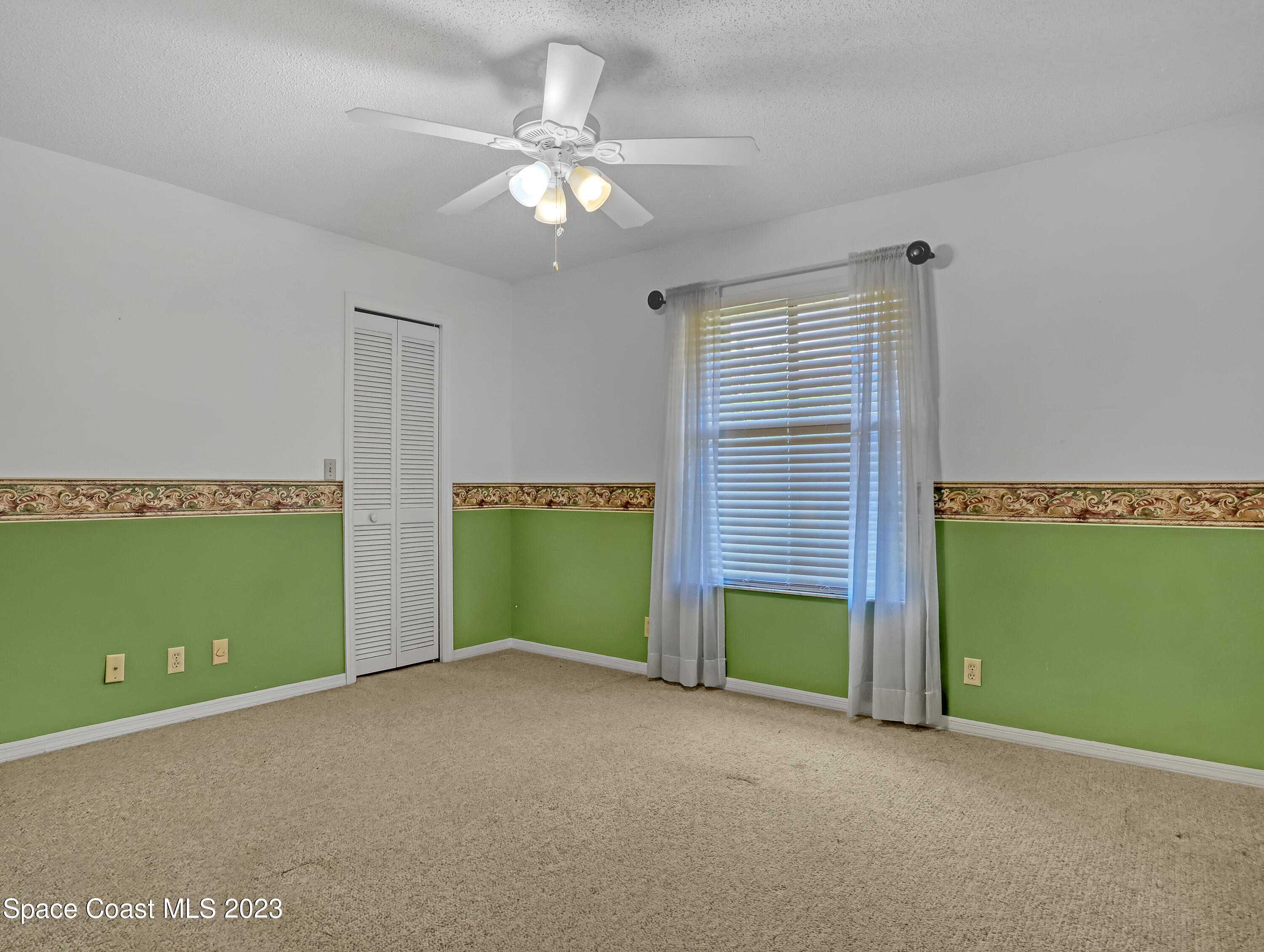 705 Casa Grande Drive Melbourne, FL 32940 - Photo 22 of 32 a view of an empty room with a window