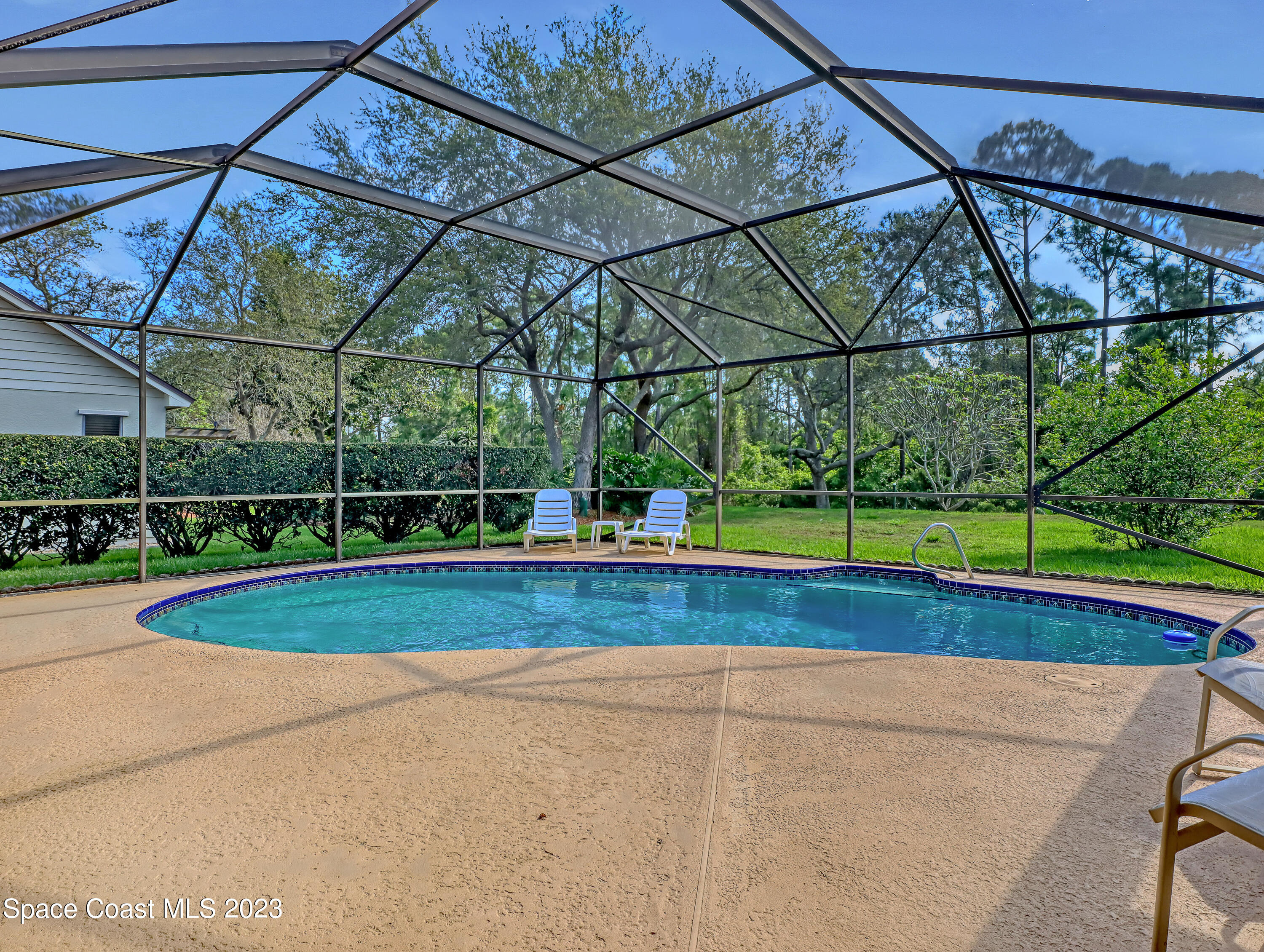 705 Casa Grande Drive Melbourne, FL 32940 - Photo 25 of 32 a view of yard with swimming pool
