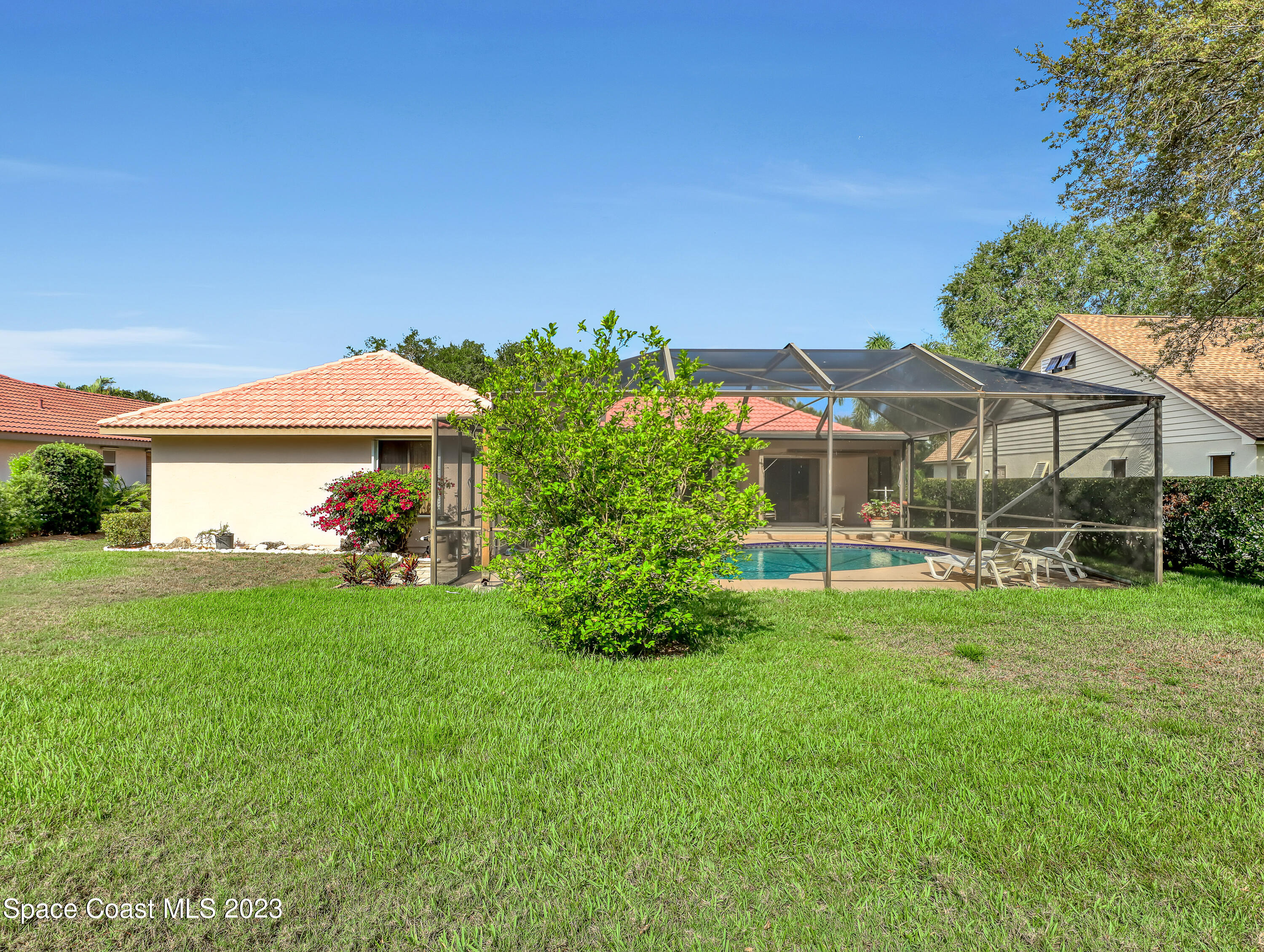 705 Casa Grande Drive Melbourne, FL 32940 - Photo 27 of 32 a front view of a house with garden