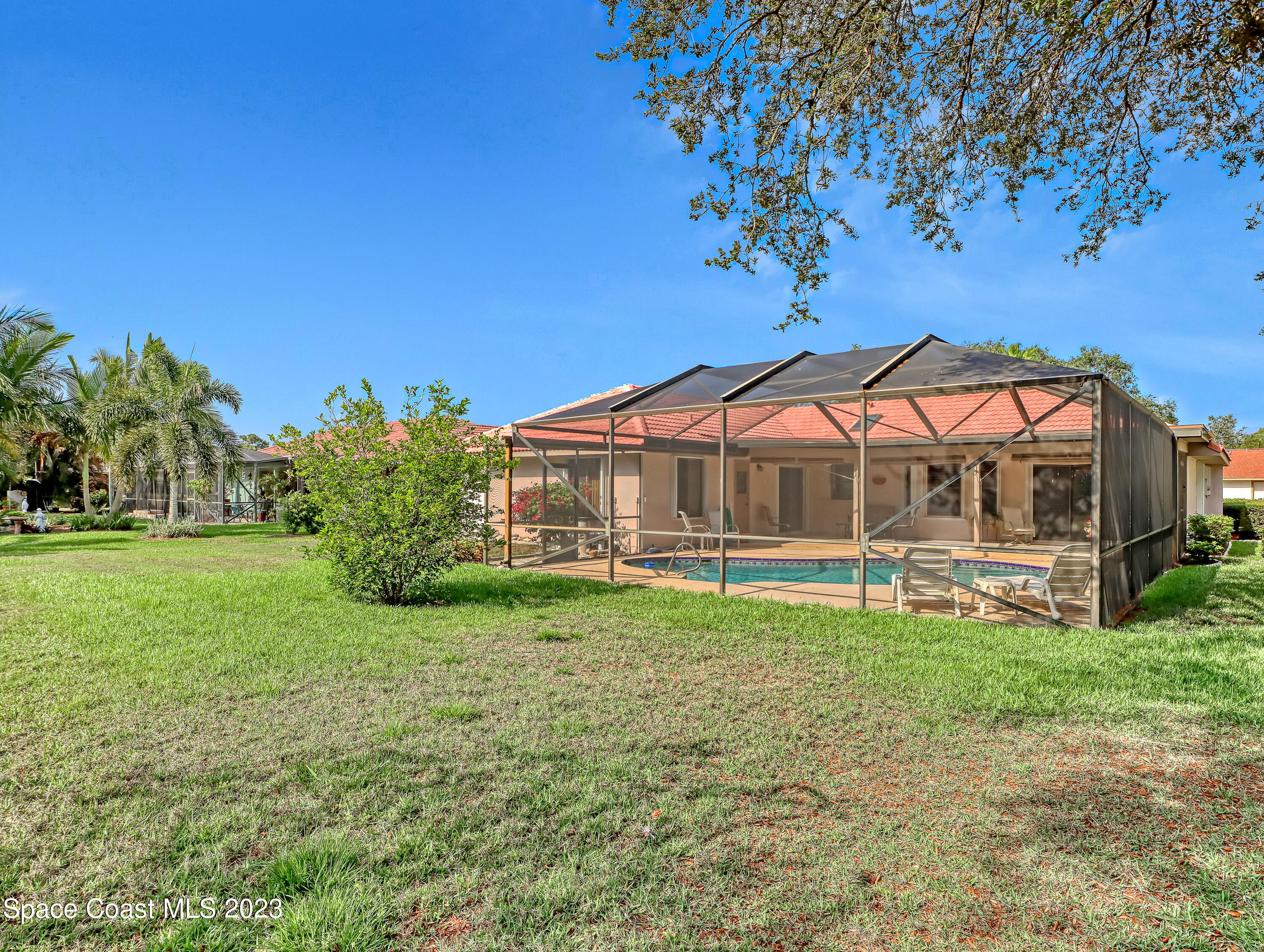 705 Casa Grande Drive Melbourne, FL 32940 - Photo 28 of 32 a view of a house with a yard