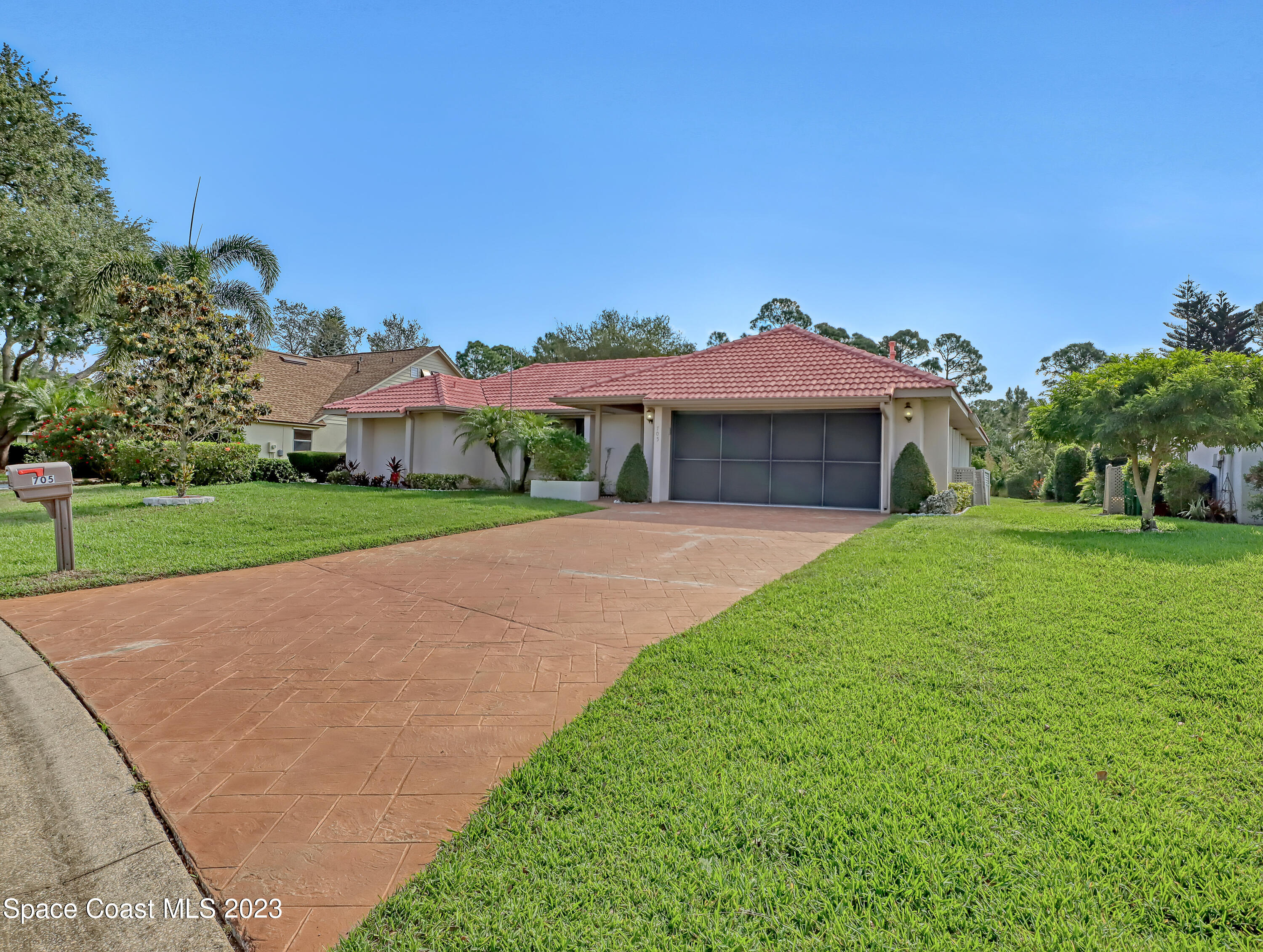 705 Casa Grande Drive Melbourne, FL 32940 - Photo 32 of 32 a front view of a house with yard and green space