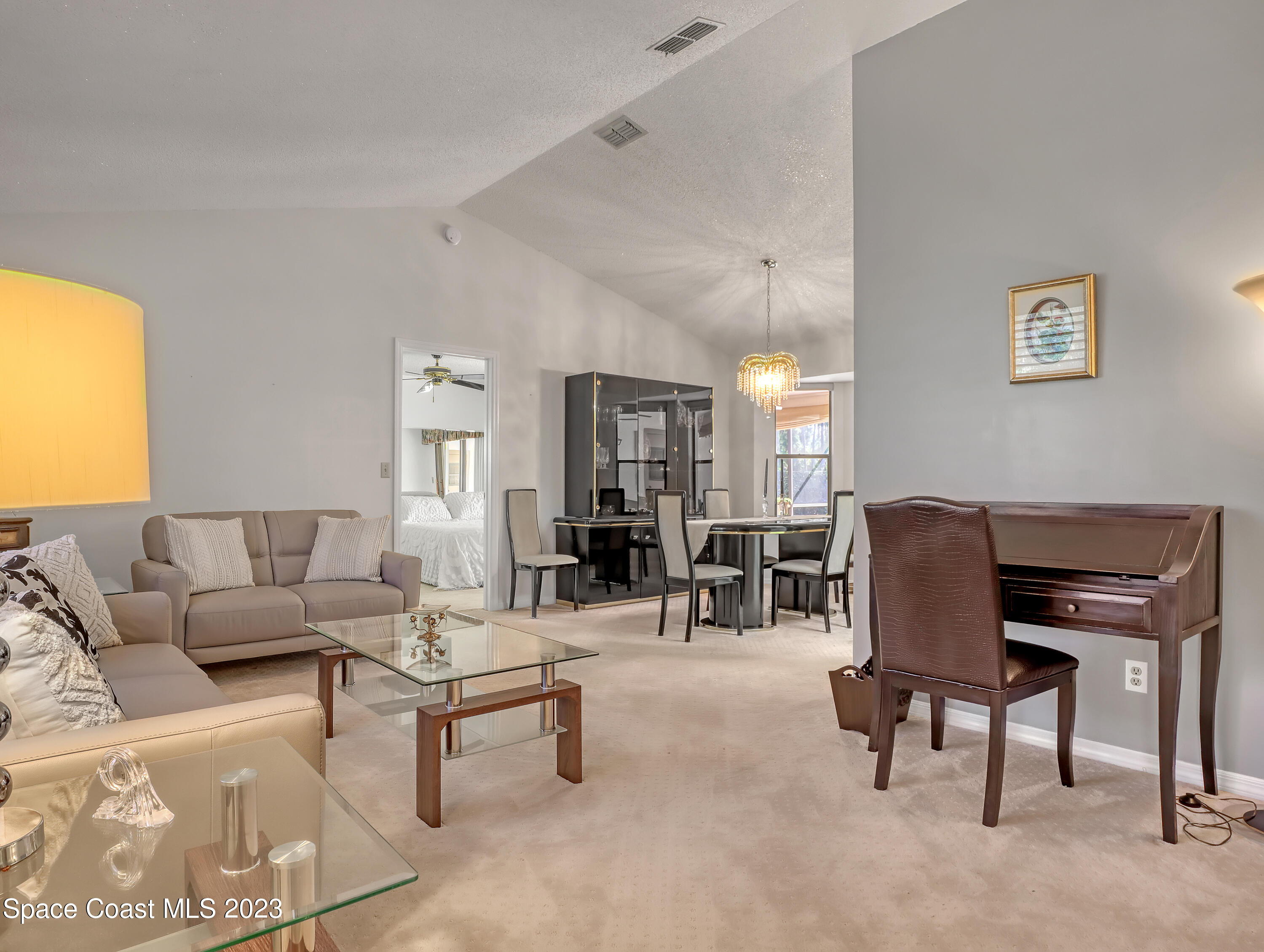 705 Casa Grande Drive Melbourne, FL 32940 - Photo 7 of 32 a living room with furniture and a large window