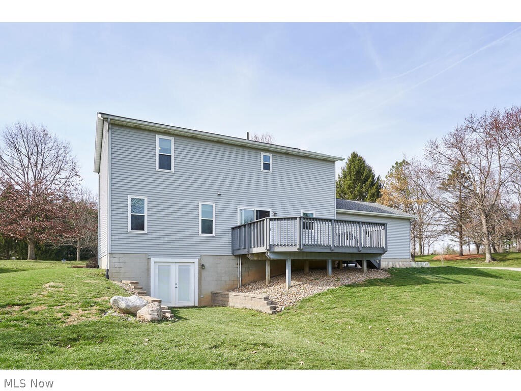 4009 Dan Road Medina, OH 44256 - Photo 23 of 29 Back of property with a deck and a yard