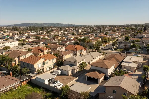 an aerial view of a house with a ocean view