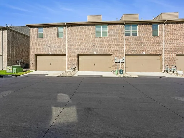 a view of a house with a street