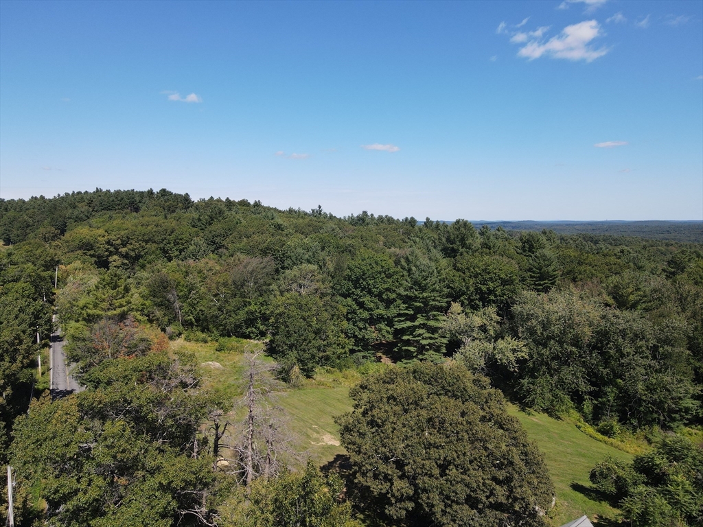 129 Oak Hill Road Harvard, MA 01451 - Photo 23 of 24 a view of a field of grass and trees