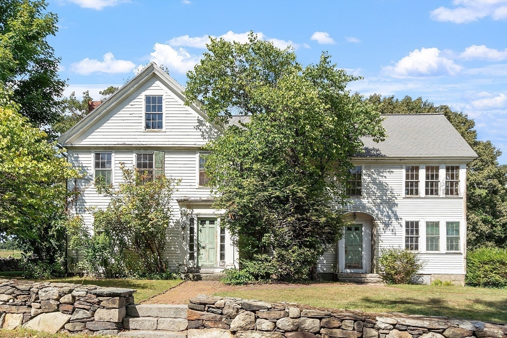 129 Oak Hill Road Harvard, MA 01451 - Photo 4 of 24 a front view of a house with a yard