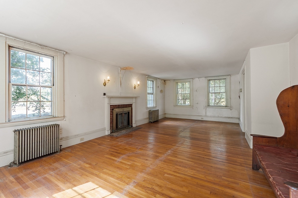129 Oak Hill Road Harvard, MA 01451 - Photo 8 of 24 a view of an empty room with window and wooden floor