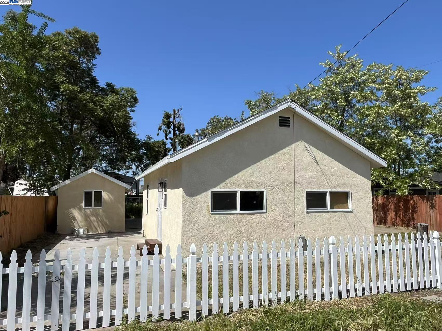 a front view of a house with a small yard