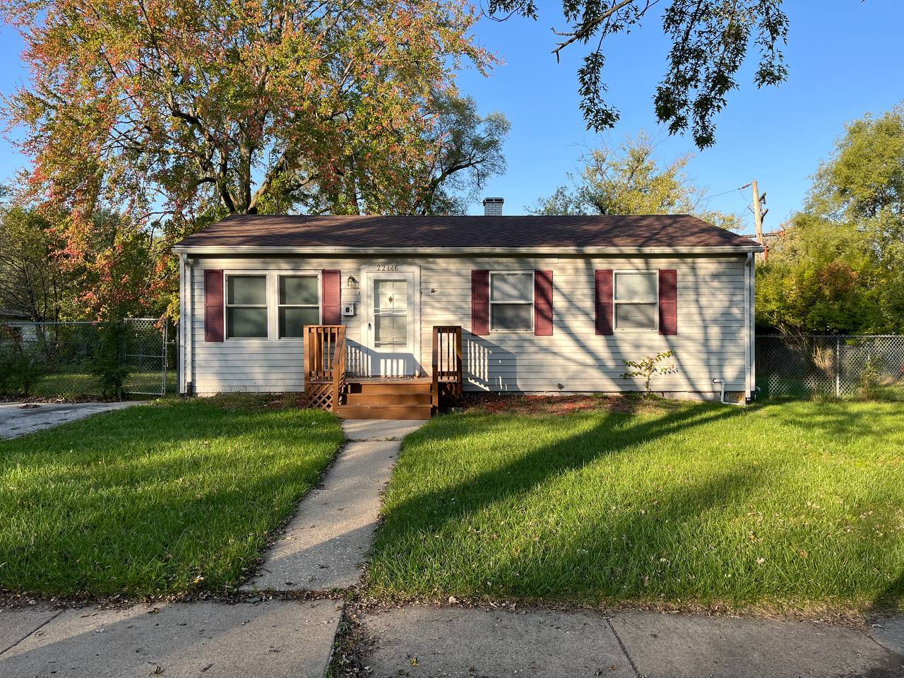 22146 Yates Avenue Sauk Village, IL 60411 - Photo 1 of 10 front view of a house with a yard