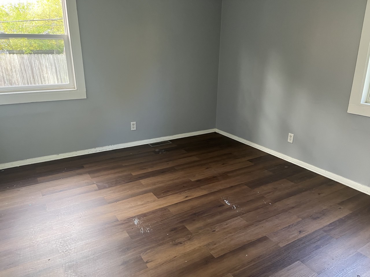 22146 Yates Avenue Sauk Village, IL 60411 - Photo 5 of 10 a view of an empty room with wooden floor and a window