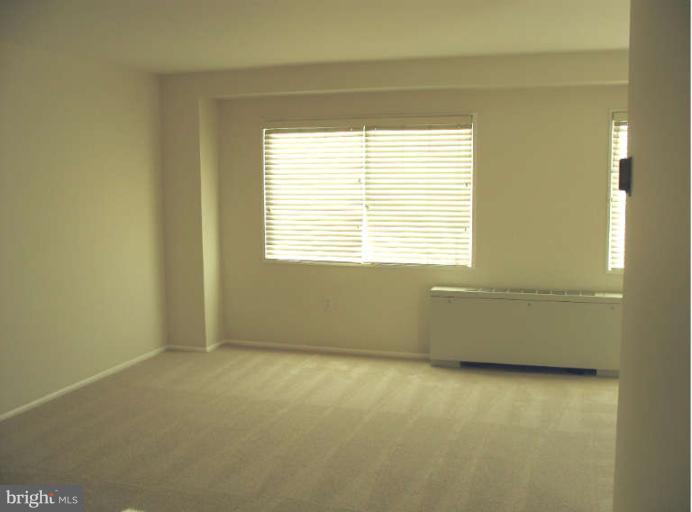 1111 University Boulevard West, Unit 1014 Silver Spring, MD 20902 - Photo 6 of 8 a room with a window
