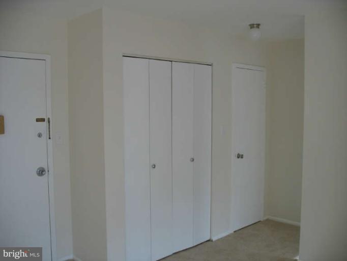 1111 University Boulevard West, Unit 1014 Silver Spring, MD 20902 - Photo 7 of 8 a view of a hallway