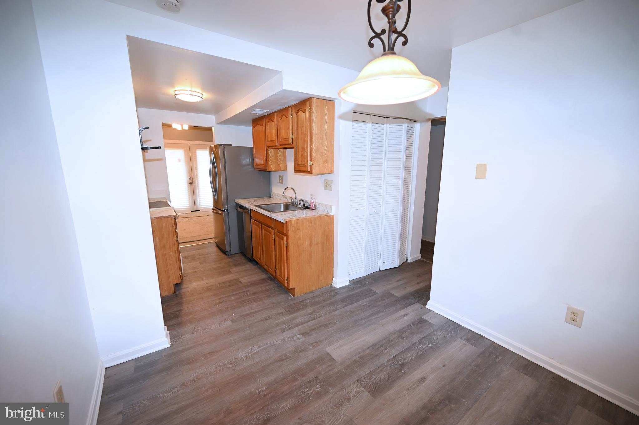2223 Anvil Lane Temple Hills, MD 20748 - Photo 14 of 30 a view of kitchen and wooden floor