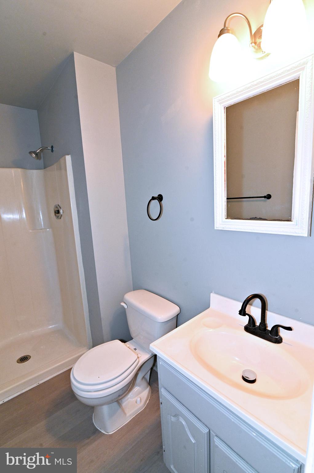 2223 Anvil Lane Temple Hills, MD 20748 - Photo 23 of 30 a bathroom with a toilet sink and shower