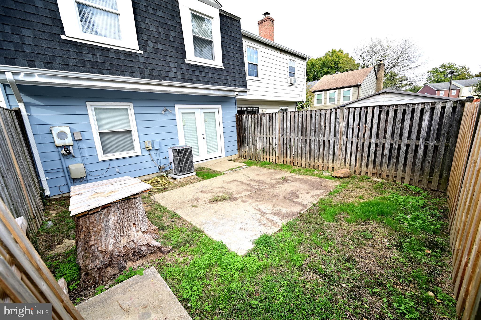 2223 Anvil Lane Temple Hills, MD 20748 - Photo 5 of 30 a view of backyard with a patio and wooden fence