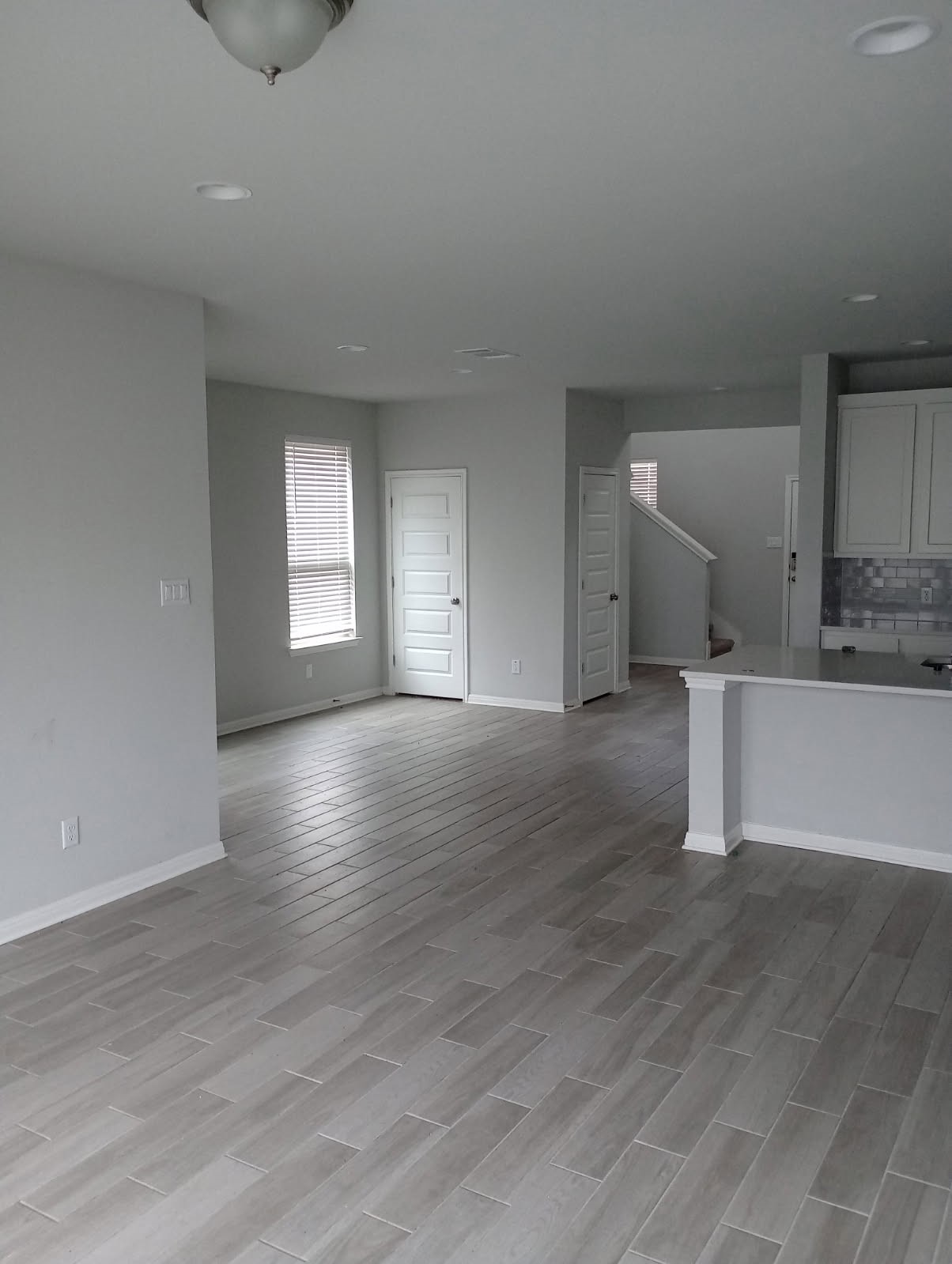 336 Mclintock Road Jarrell, TX 76537 - Photo 4 of 14 a view of empty room with wooden floor and window
